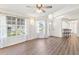 Laminate floors and plentiful sunlight make this living space shine at 26030 Newcombe Cir, Leesburg, FL 34748
