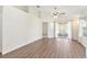 Spacious living area with new flooring and sliding glass door at 26030 Newcombe Cir, Leesburg, FL 34748