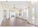 Open living room with new laminate flooring and sliding doors at 26030 Newcombe Cir, Leesburg, FL 34748