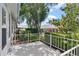 Rear patio with partial view of adjacent units at 26030 Newcombe Cir, Leesburg, FL 34748