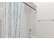 Shower with white tiling and a shower head at 26030 Newcombe Cir, Leesburg, FL 34748