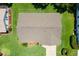 Overhead home view showing the roof, landscaping, and surrounding properties at 26608 Racquet Cir, Leesburg, FL 34748
