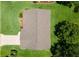 Aerial view of the roof and driveway highlighting the property's layout at 26608 Racquet Cir, Leesburg, FL 34748