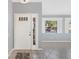 Bright foyer with tile floors and natural light from front door and windows at 26608 Racquet Cir, Leesburg, FL 34748