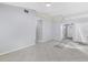 Bright living area with tile flooring, ceiling fan, and neutral paint color at 26608 Racquet Cir, Leesburg, FL 34748