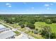 Expansive aerial view of a charming home nestled amidst lush greenery and picturesque landscapes at 2845 County Road 523, Wildwood, FL 34785