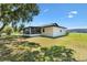 The home features a screened porch overlooking the spacious backyard at 2845 County Road 523, Wildwood, FL 34785