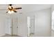 The bedroom has multiple closets and a ceiling fan at 2845 County Road 523, Wildwood, FL 34785