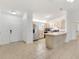 Bright kitchen featuring stainless steel appliances and breakfast bar with an open floor plan at 2845 County Road 523, Wildwood, FL 34785