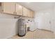 Handy laundry room boasts storage, a sink and easy access to the exterior at 2845 County Road 523, Wildwood, FL 34785