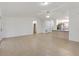 Open-concept living space showcasing tile floors connecting to the kitchen, bathroom, and bedrooms at 2845 County Road 523, Wildwood, FL 34785