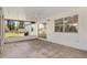 Relax on the expansive screened porch with a ceiling fan and views of the backyard at 2845 County Road 523, Wildwood, FL 34785
