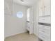 Walk-in closet featuring shelves and cabinets at 2845 County Road 523, Wildwood, FL 34785