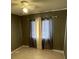 Comfortable bedroom featuring carpet flooring, a ceiling fan, and a window with privacy blinds at 3041 Bloomsbury Dr, Kissimmee, FL 34747
