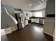 Spacious kitchen featuring stainless steel appliances, granite countertops, and hardwood flooring at 3041 Bloomsbury Dr, Kissimmee, FL 34747