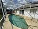 Inviting screened-in pool area, perfect for relaxation and outdoor entertainment at 3041 Bloomsbury Dr, Kissimmee, FL 34747