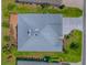 An aerial view reveals meticulous landscaping, a pristine roof, and a charming patio at 3136 Vandenberg Ct, The Villages, FL 32163