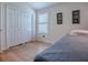 Bright bedroom featuring a large closet, wood floors, and natural light at 3136 Vandenberg Ct, The Villages, FL 32163