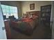 Cozy bedroom features a comfortable bed, large window, and built-in bookcase at 3205 Sonesta Ct # B, Clermont, FL 34711