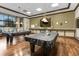 Billiard room featuring two covered tables, warm lighting, and a relaxed ambiance for friendly games and entertainment at 3205 Sonesta Ct # B, Clermont, FL 34711