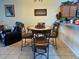 Eat-in kitchen area featuring a round table with seating, kitchen bar top, and easy access to appliances at 3205 Sonesta Ct # B, Clermont, FL 34711