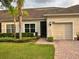 Well-maintained home with a two-car garage, neat landscaping, and a brick pathway to the front door at 3205 Sonesta Ct # B, Clermont, FL 34711