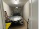 Attached garage with a car, ladder, and storage shelves at 3205 Sonesta Ct # B, Clermont, FL 34711