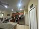 Well-lit kitchen with stainless steel appliances, granite countertops, and ample cabinet space for storage at 3205 Sonesta Ct # B, Clermont, FL 34711