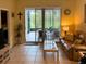 Comfortable living area with tile floors, sliding glass doors to a patio, and relaxing seating arrangement at 3205 Sonesta Ct # B, Clermont, FL 34711