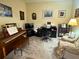 Comfortable living room with piano, desk, sofa, and plenty of natural light at 3205 Sonesta Ct # B, Clermont, FL 34711
