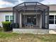 Relaxing screened-in patio with comfortable seating, perfect for enjoying the outdoors in comfort and style at 3205 Sonesta Ct # B, Clermont, FL 34711