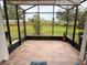 Spacious screened porch with tiled floor, peaceful views, and ample sunlight at 3205 Sonesta Ct # B, Clermont, FL 34711