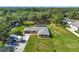 Spacious lot boasts a well-maintained lawn, long driveway and enclosed backyard swimming pool at 3380 Blossom St, Kissimmee, FL 34746