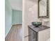 Well-lit bathroom featuring vessel sink, decorative mirror and updated fixtures at 3380 Blossom St, Kissimmee, FL 34746