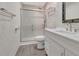 Bathroom featuring tiled walls, glass enclosed shower, and vanity with sink at 3380 Blossom St, Kissimmee, FL 34746