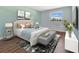 Bright bedroom featuring a large bed, stylish decor, and a sunlit window at 3380 Blossom St, Kissimmee, FL 34746