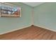 Empty bedroom has hardwood floors, plenty of natural light and closet for storage at 3380 Blossom St, Kissimmee, FL 34746