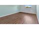 Empty bedroom features durable wood flooring and ample natural light at 3380 Blossom St, Kissimmee, FL 34746