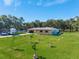 Beautiful home with luscious green lawn, long driveway and open two-car garage at 3380 Blossom St, Kissimmee, FL 34746