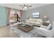 Cozy living room with stylish furnishings, neutral color palette, and sliding door access at 3380 Blossom St, Kissimmee, FL 34746