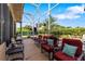 Relaxing screened patio with comfortable seating and view of landscaped backyard at 34021 Park Ln, Leesburg, FL 34788