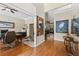 Hallway featuring hardwood floors that connects the living area to a private office at 34021 Park Ln, Leesburg, FL 34788