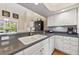 Bright kitchen with white cabinets, sleek countertops, and modern appliances at 34021 Park Ln, Leesburg, FL 34788