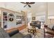 Spacious living room with large built-ins, hardwood floors, and comfortable seating at 34021 Park Ln, Leesburg, FL 34788