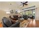 Elegant living room with large windows, hardwood floors, and comfortable seating at 34021 Park Ln, Leesburg, FL 34788