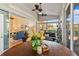 Bright sunroom with many windows that let in sunlight, and comfortable seating at 34021 Park Ln, Leesburg, FL 34788