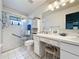 Clean bathroom with tiled floors, a glass-enclosed shower, and a vanity area with lots of storage at 3706 Doune Way, Clermont, FL 34711