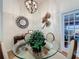 Formal dining area featuring stylish decor, elegant chandelier, and a glass top dining table at 3706 Doune Way, Clermont, FL 34711