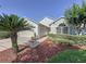 Inviting home exterior with neat landscaping, healthy bushes, and a lush lawn at 3706 Doune Way, Clermont, FL 34711