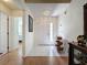 Bright foyer with tile flooring, a decorative chandelier, and a glimpse of the living spaces at 3706 Doune Way, Clermont, FL 34711